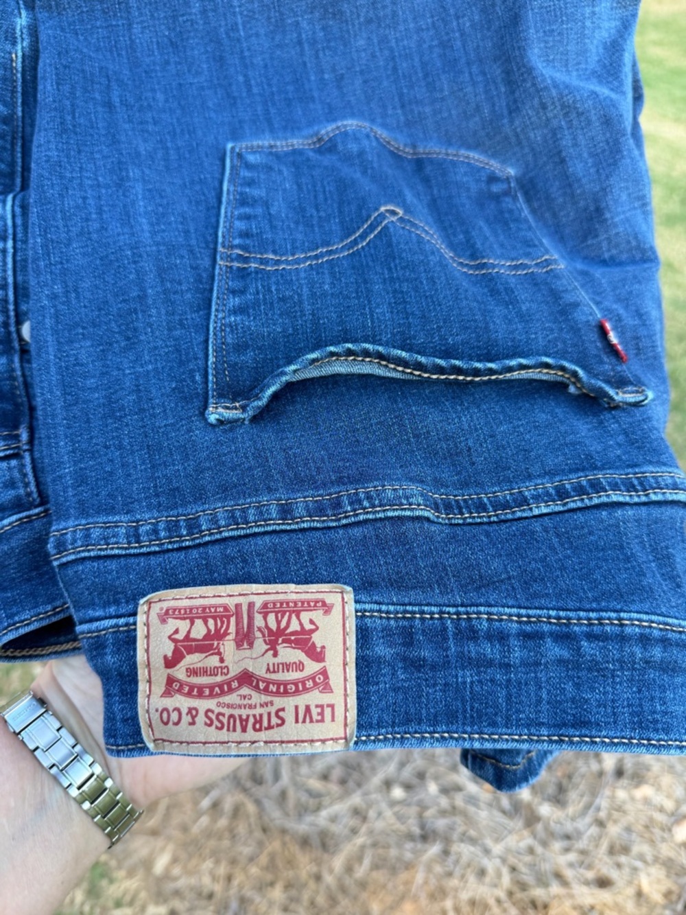 Women’s Levi's Classic Blue Denim Jeans with Red Patch and Button Logo, 24W